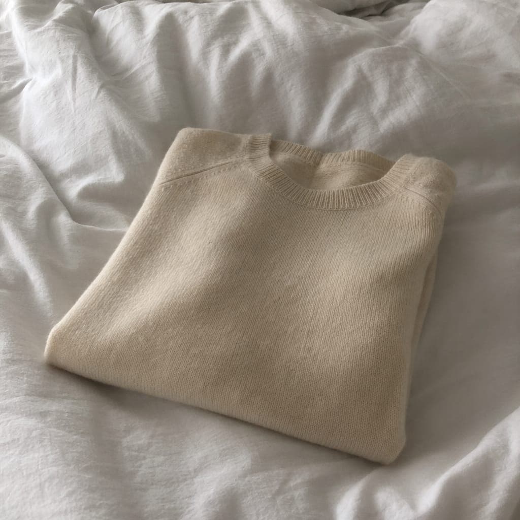 Cashmere sweater on white linen
